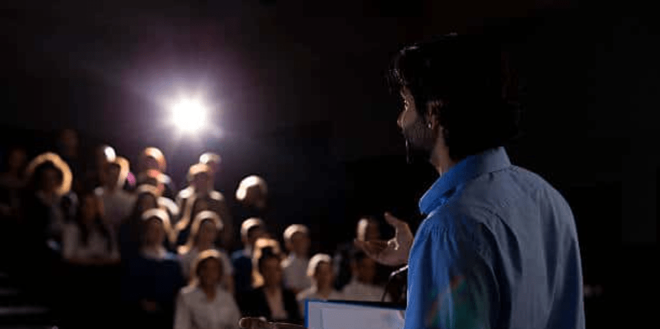 Man standing in front of an audience